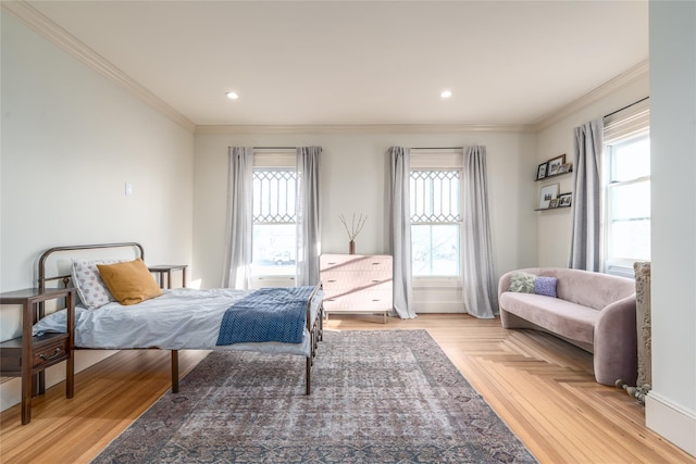 bedroom featuring parquet floors, multiple windows, crown molding, and recessed lighting