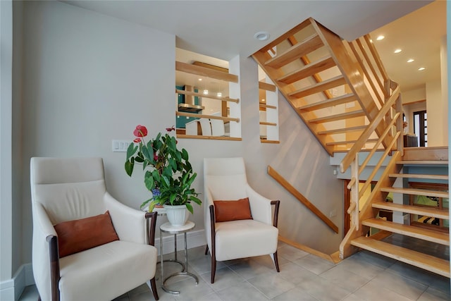 living area featuring tile patterned floors, stairs, and recessed lighting