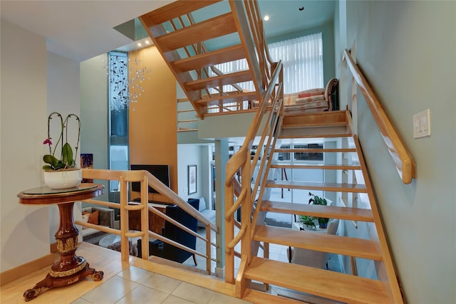 stairs with tile patterned floors