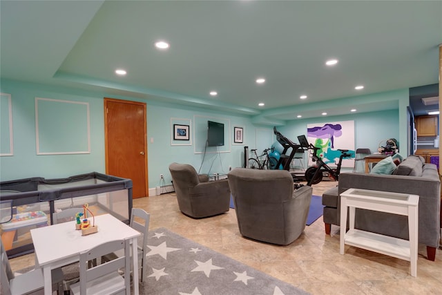 living room with a baseboard radiator and recessed lighting