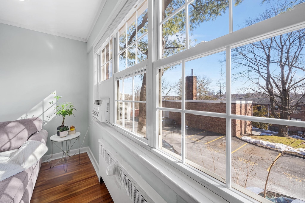 27 Fieldstone Dr Unit 179, Hartsdale, NY 10530 - living area featuring baseboards, wood finished floors, and crown molding