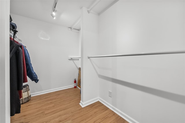 walk in closet featuring light wood-type flooring