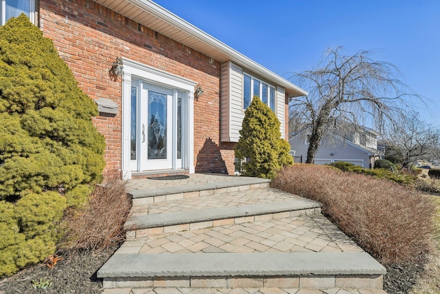 entrance to property with brick siding