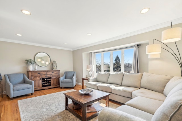 living area featuring recessed lighting, light wood-type flooring, and crown molding