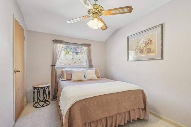 carpeted bedroom featuring ceiling fan and baseboards