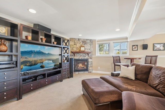 carpeted living area featuring ornamental molding, a fireplace, recessed lighting, and baseboards