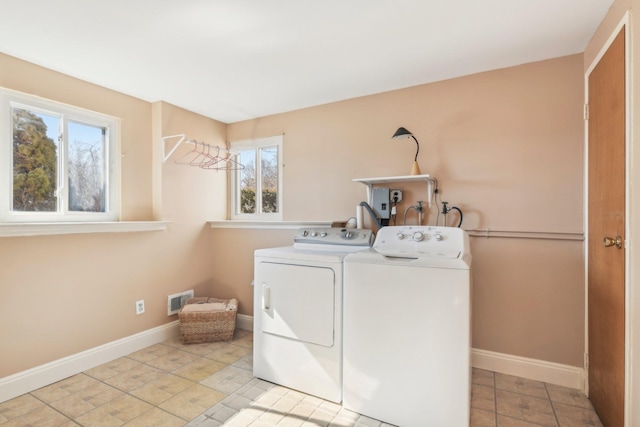 laundry room with washer and dryer, laundry area, visible vents, and baseboards