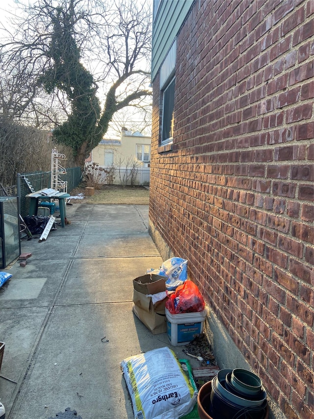 view of patio / terrace featuring fence