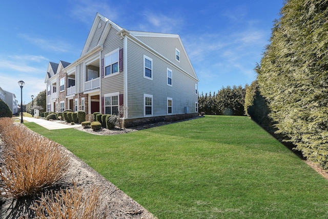 view of home's exterior with a lawn