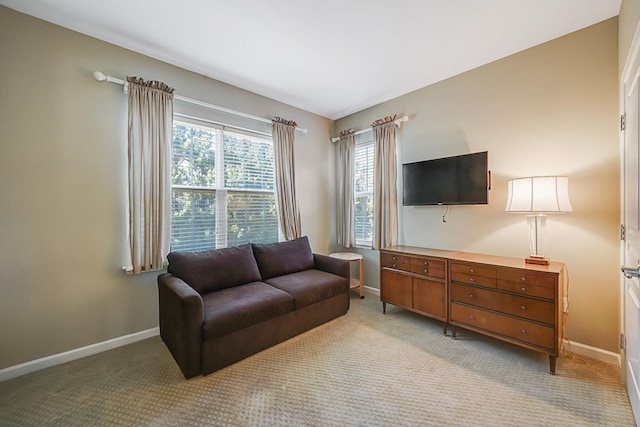 living room with light colored carpet and baseboards