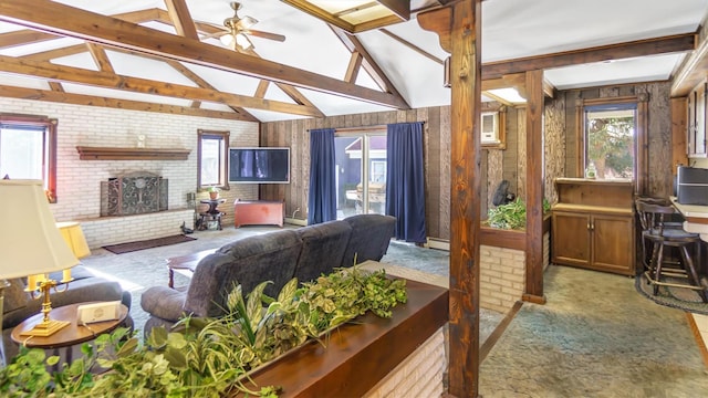 155 Shepard Dr, Southold, NY 11971 - living room with a healthy amount of sunlight, light colored carpet, and a fireplace