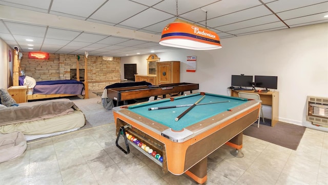 155 Shepard Dr, Southold, NY 11971 - recreation room featuring a wood stove, a drop ceiling, and heating unit