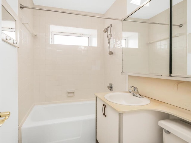 bathroom with toilet, washtub / shower combination, and vanity