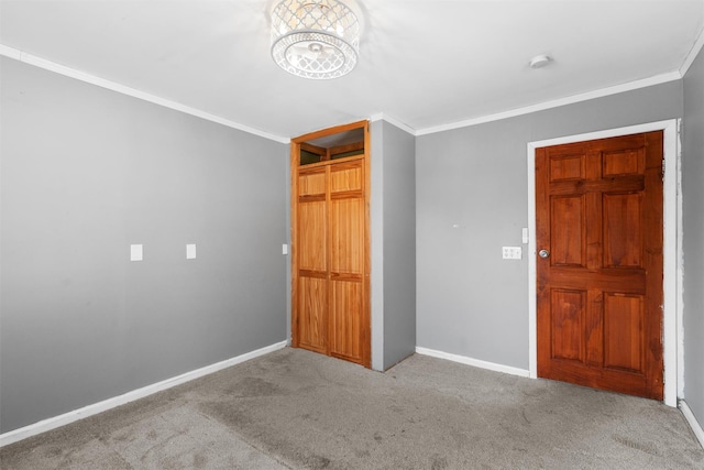 unfurnished bedroom with baseboards, ornamental molding, and light colored carpet