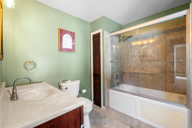 full bathroom with vanity, toilet, and bath / shower combo with glass door