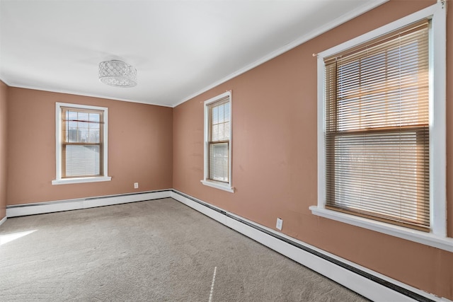 unfurnished room with a baseboard heating unit, crown molding, and carpet floors