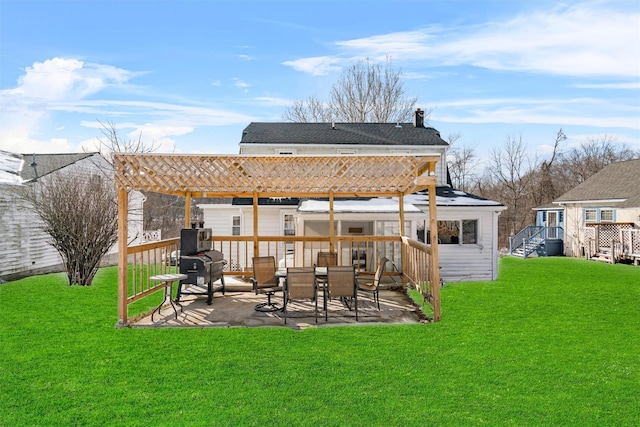 back of house featuring a patio area, a yard, and a pergola