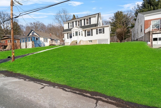 view of front of home with a front lawn and a residential view