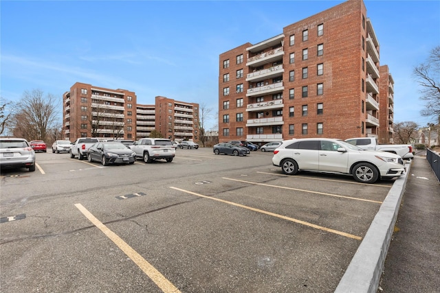 view of building exterior featuring uncovered parking