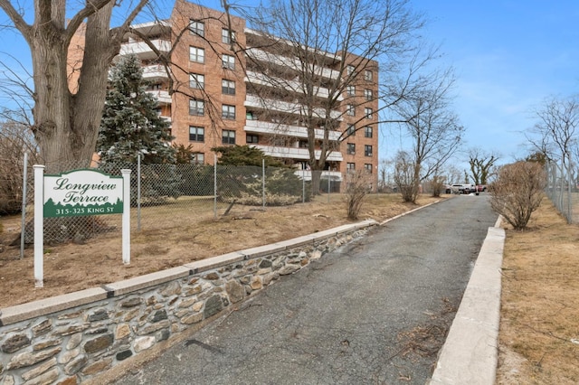 view of building exterior with fence