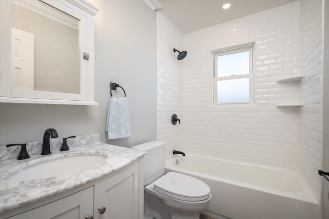 bathroom with  shower combination, vanity, and toilet