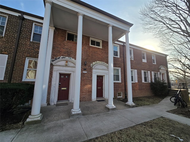 view of front of property featuring brick siding