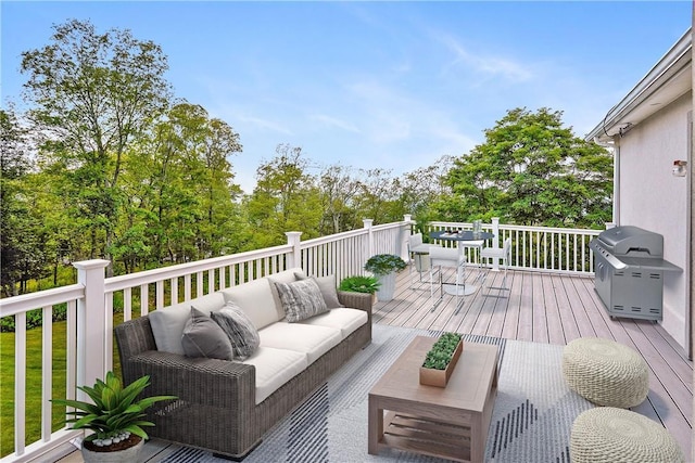 deck featuring grilling area and an outdoor living space