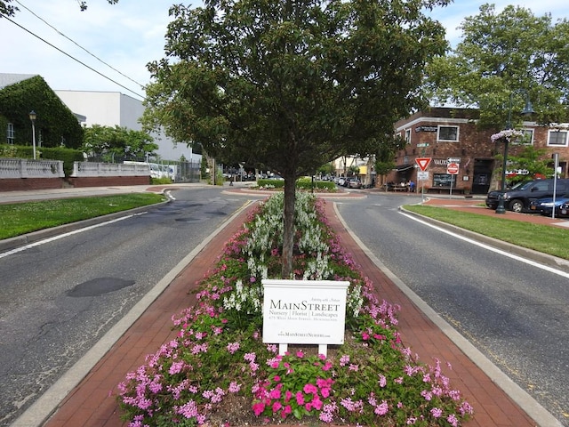 view of road with curbs and traffic signs