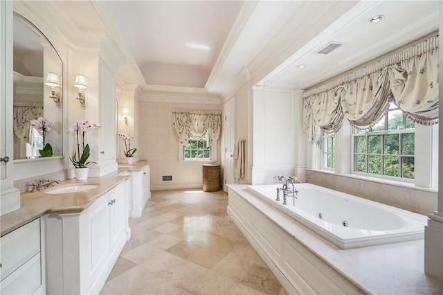 bathroom featuring ornamental molding, visible vents, vanity, and a whirlpool tub