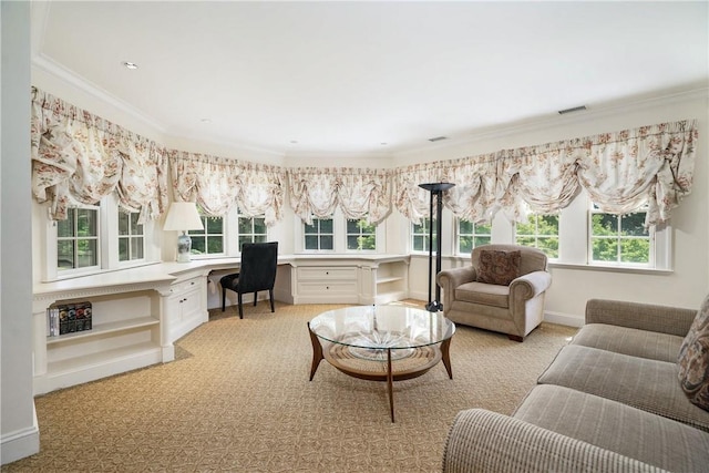 office with ornamental molding, built in study area, visible vents, and baseboards