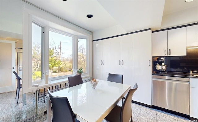 dining room with granite finish floor, baseboards, and recessed lighting