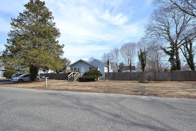 view of side of home with fence