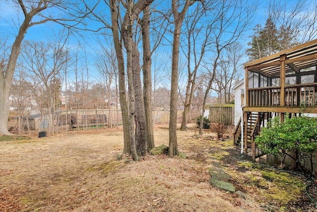 view of yard with a deck and stairway