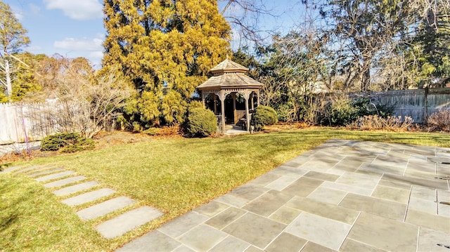 view of yard with a gazebo, a patio, and fence