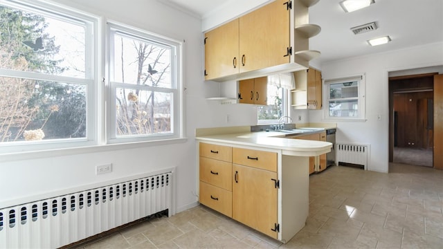 kitchen with radiator, light countertops, visible vents, and open shelves