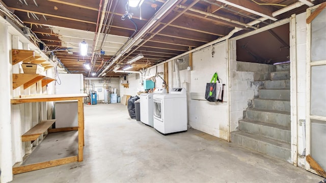 unfinished basement featuring washer and clothes dryer