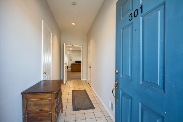 interior space featuring visible vents, baseboards, and light tile patterned floors