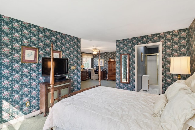 carpeted bedroom featuring wallpapered walls and baseboards