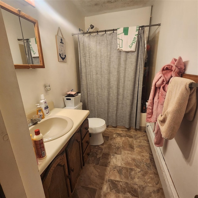 full bath featuring toilet, stone finish flooring, shower / tub combo, and vanity