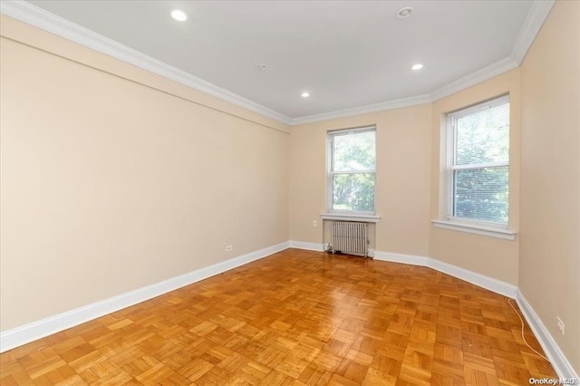 unfurnished room featuring radiator, baseboards, crown molding, and recessed lighting