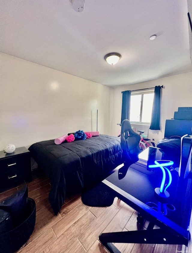 bedroom featuring wood finished floors