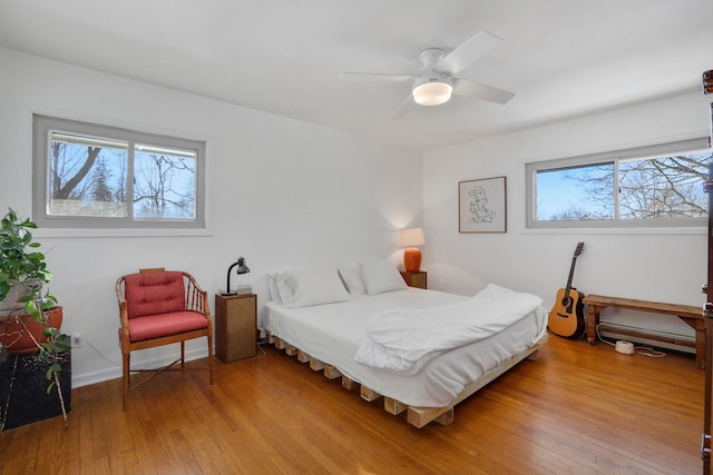 bedroom featuring light wood-type flooring and ceiling fan