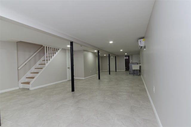 finished below grade area featuring recessed lighting, stairway, and baseboards