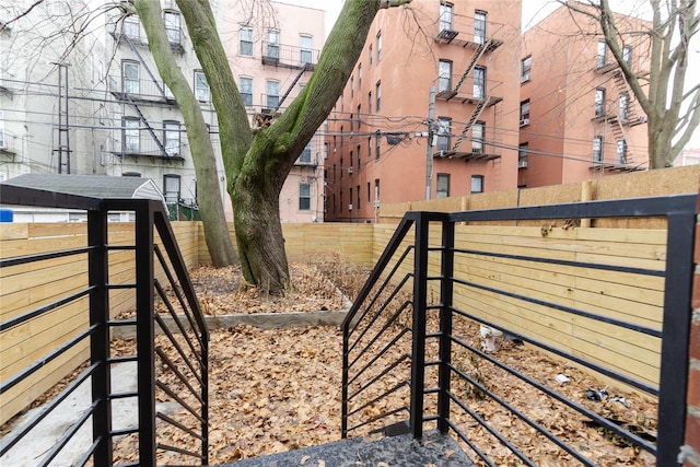 view of gate with fence