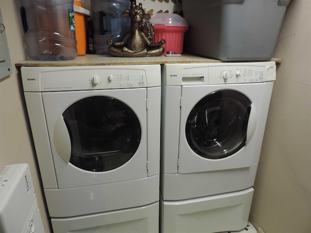 laundry area with washing machine and clothes dryer