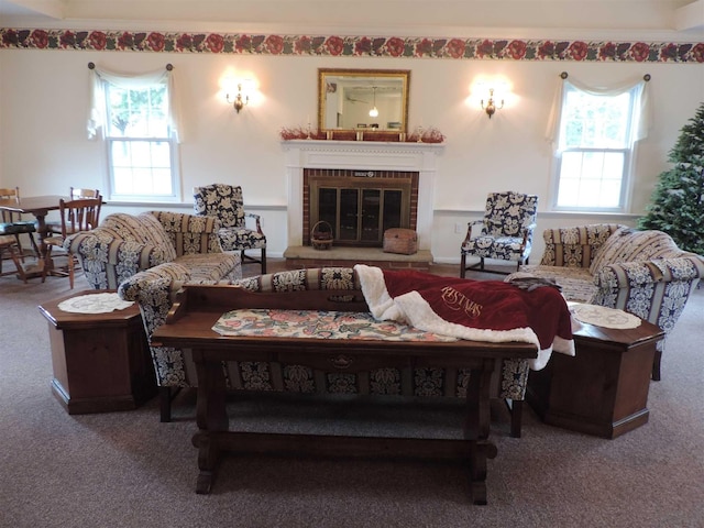 living area with carpet floors and a fireplace