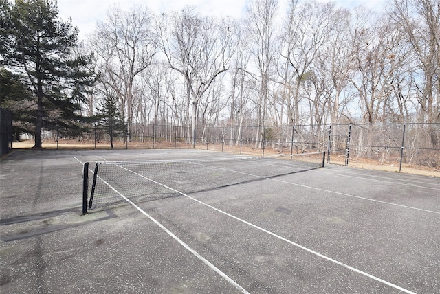 view of sport court with fence