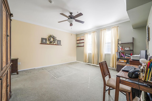 office space with light carpet, ornamental molding, and baseboards