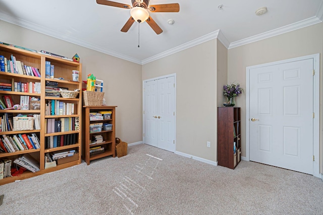 interior space with a ceiling fan, light carpet, crown molding, and baseboards