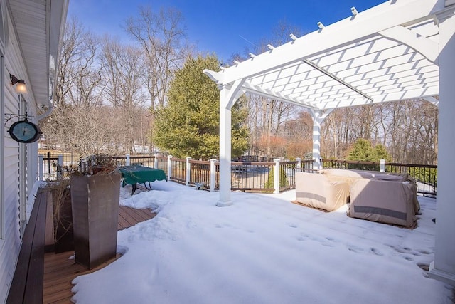 yard layered in snow with a hot tub, fence, a pergola, and a wooden deck